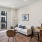 a living room with a couch and a rug