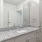 bathroom with a large mirror and ample lighting