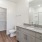 bathroom with a large mirror and ample lighting