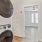 stacked laundry appliances in a narrow closet